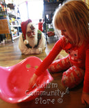 Santa watching girl play with Bilibo